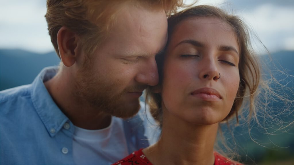 Love couple enjoy summer holiday. Closeup sexy marriage close eyes in mountains